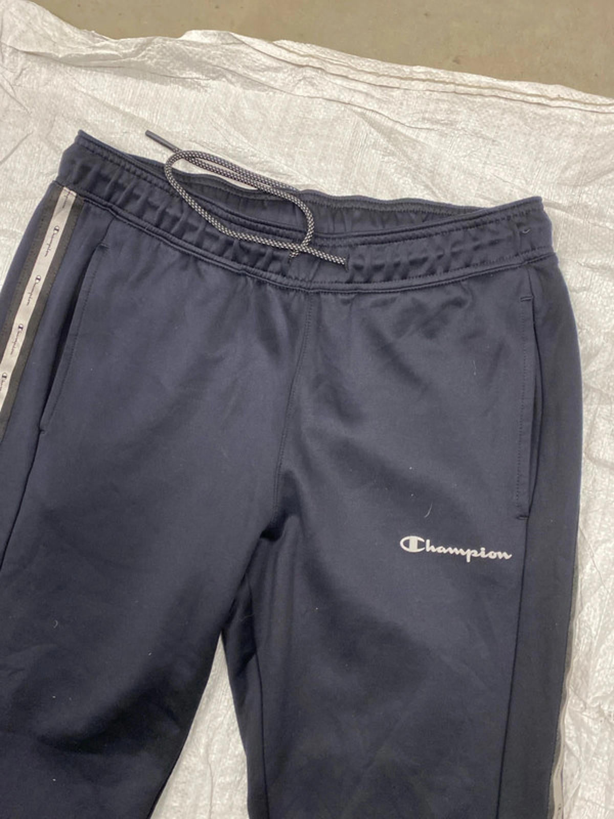 Champion Joggers deep blue leg graphics. Small